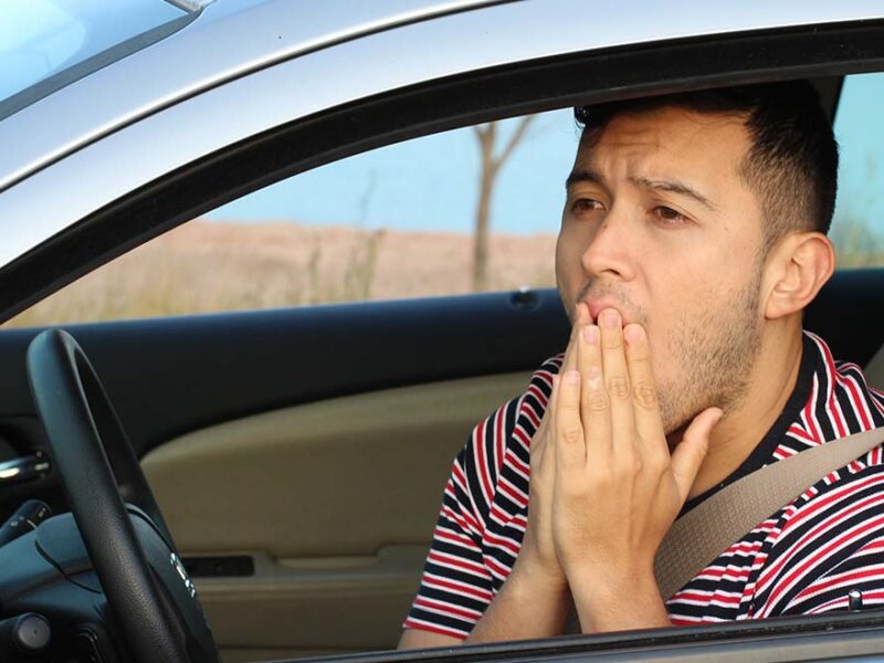 concerned man driving