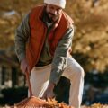 man raking leaves